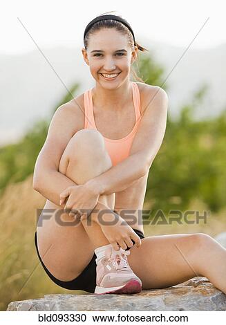 Stock Image - Caucasian woman in sportswear outdoors. Fotosearch