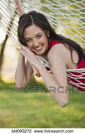 Caucasian woman laying in hammock View Large Photo Image Stock Image - Caucasian woman laying in hammock. Fotosearch