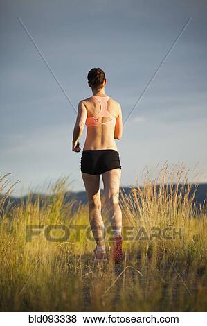 Caucasian woman running in remote area View Large Photo Image Stock Photo - Caucasian woman running in remote area. Fotosearch