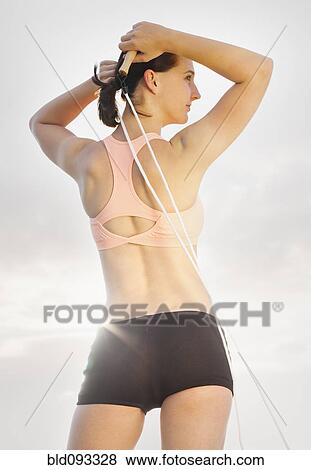 Caucasian woman standing with jump rope View Large Photo Image Stock Photo - Caucasian woman standing with jump rope. Fotosearch