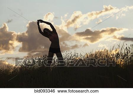Caucasian woman stretching before exercise View Large Photo Image Stock Photograph - Caucasian woman stretching before exercise. Fotosearch
