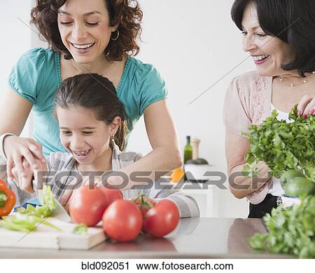 Family cooking together View Large Photo Image Stock Image - Family cooking together. Fotosearch