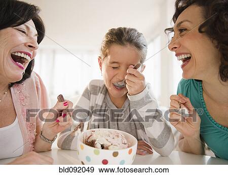 Stock Photo - Family eating ice cream together. Fotosearch