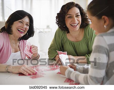 Grandmother, mother and daughter playing cards View Large Photo Image Stock Photography - Grandmother, mother and daughter playing cards. Fotosearch