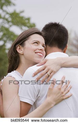 Hispanic couple hugging outdoors View Large Photo Image Picture - Hispanic couple hugging outdoors. Fotosearch