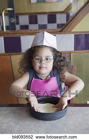 Hispanic girl baking View Large Photo Image Stock Image - Hispanic girl baking. Fotosearch