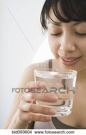 Hispanic woman drinking water View Large Photo Image Picture - Hispanic woman drinking water. Fotosearch
