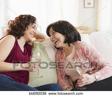 Stock Photo - Mother and daughter drinking wine together. Fotosearch