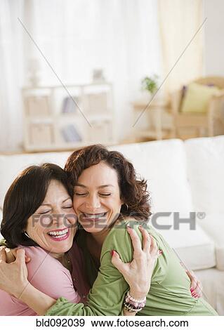 Mother and daughter hugging View Large Photo Image Stock Photo - Mother and daughter hugging. Fotosearch