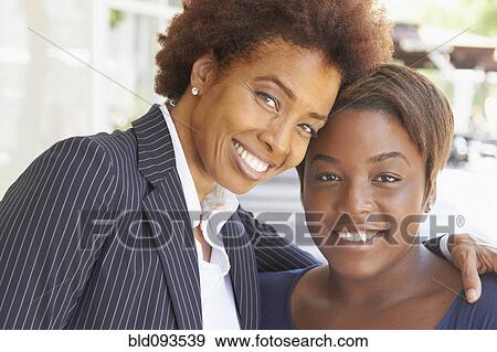 Smiling African American mother and daughter View Large Photo Image Stock Photo - Smiling African American mother and daughter. Fotosearch