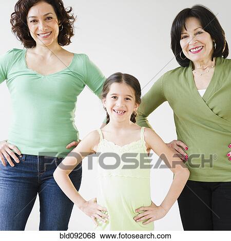 Stock Photo - Smiling, grandmother, mother and daughter. Fotosearch