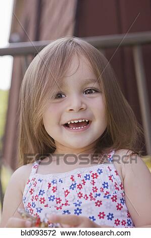 Stock Image - Smiling Hispanic girl. Fotosearch