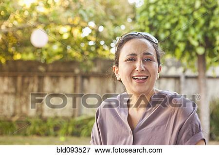 Stock Photo - Smiling Hispanic woman. Fotosearch