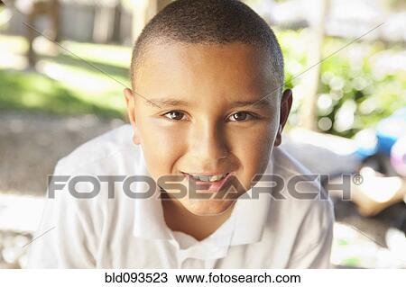 Stock Image - Smiling mixed race boy. Fotosearch