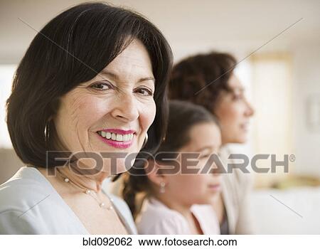 Smiling woman with family View Large Photo Image Stock Image - Smiling woman with family. Fotosearch