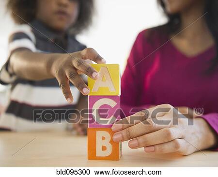 African American mother and son playing with blocks View Large Photo Image Stock Image - African American mother and son playing with blocks. Fotosearch