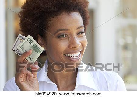African American woman holding 50 dollar bill View Large Photo Image Stock Image - African American woman holding 50 dollar bill. Fotosearch