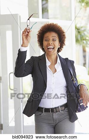 African American woman with arms raised outdoors View Large Photo Image Stock Image - African American woman with arms raised outdoors. Fotosearch