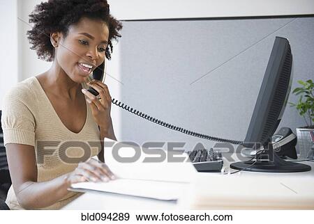 Black businesswoman talking on telephone View Large Photo Image Stock Photo - Black businesswoman talking on telephone. Fotosearch