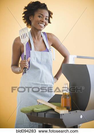 Black woman grilling on barbecue View Large Photo Image Stock Image - Black woman grilling on barbecue. Fotosearch