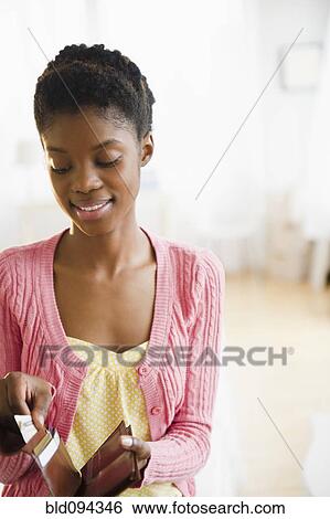 Black woman taking money out of her wallet View Large Photo Image Stock Photograph - Black woman taking money out of her wallet. Fotosearch
