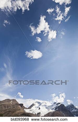 Stock Photo - Blue sky over Mount Andromeda. Fotosearch