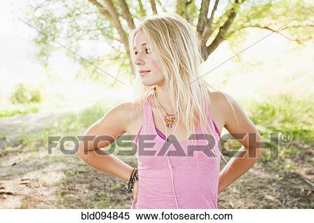 Stock Photography - Caucasian woman standing outdoors. Fotosearch