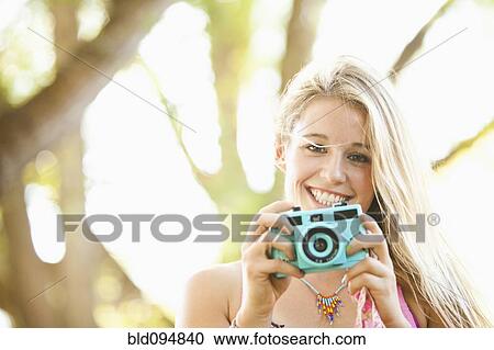 Caucasian woman taking photographs View Large Photo Image Stock Image - Caucasian woman taking photographs. Fotosearch