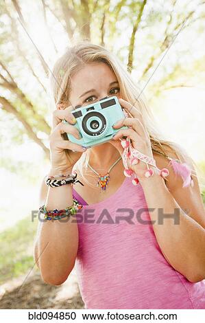 Caucasian woman taking photographs View Large Photo Image Stock Image - Caucasian woman taking photographs. Fotosearch
