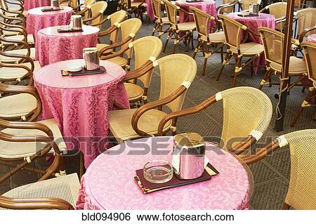 Chairs and tables in sidewalk cafe View Large Photo Image Stock Photograph - Chairs and tables in sidewalk cafe. Fotosearch