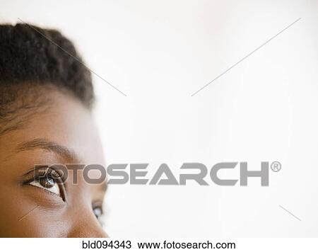 Close up of Black woman looking upwards View Large Photo Image Stock Image - Close up of Black woman looking upwards. Fotosearch