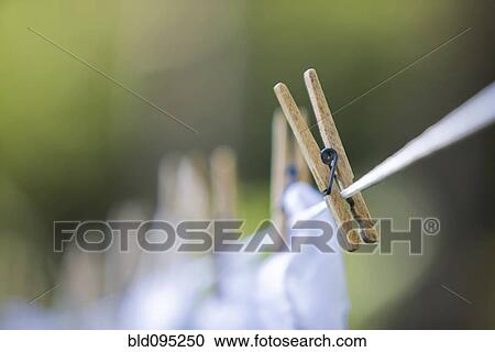 Stock Image - Close up of clothespin on clothes line. Fotosearch