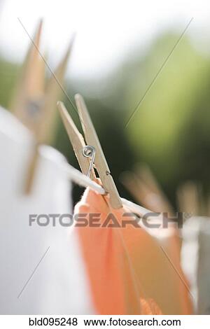 Stock Photo - Close up of laundry drying on clothes line. Fotosearch