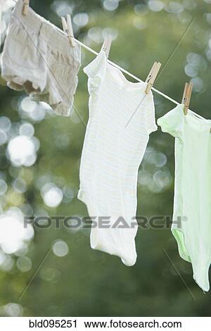 Stock Image - Close up of laundry hanging on clothes line. Fotosearch