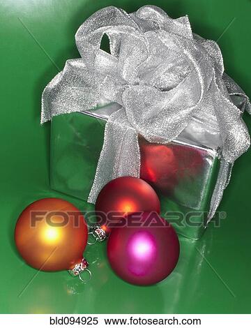 Stock Photography - Festive Christmas gift with colored ornaments. Fotosearch