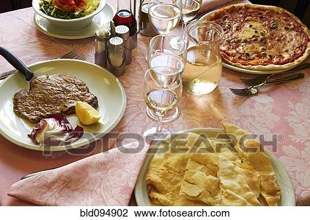 Stock Image - Food on restaurant table. Fotosearch