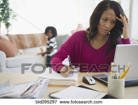 Frustrated African American woman working from home View Large Photo Image Stock Photo - Frustrated African American woman working from home. Fotosearch