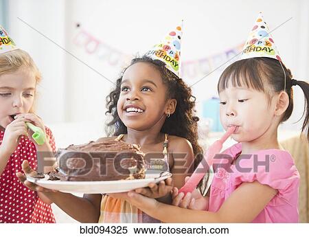 Girls holding birthday cake together View Large Photo Image Stock Photography - Girls holding birthday cake together. Fotosearch