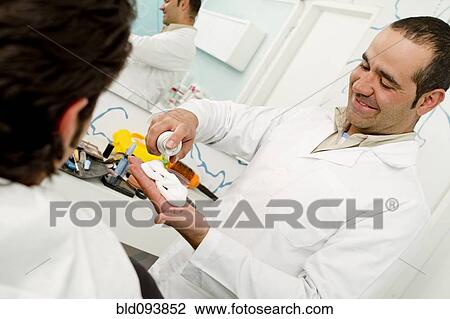 Hispanic Barber squirting saving cream into hand View Large Photo Image Stock Image - Hispanic Barber squirting saving cream into hand. Fotosearch