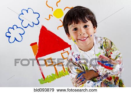 Stock Photo - Hispanic boy painting. Fotosearch