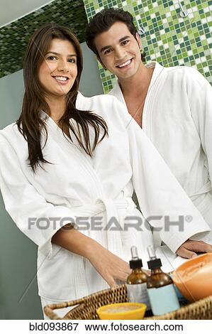 Stock Photo - Hispanic couple wearing bathrobes. Fotosearch