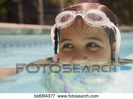 Hispanic girl swimming in swimming pool View Large Photo Image Stock Photo - Hispanic girl swimming in swimming pool. Fotosearch