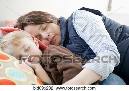 Hispanic mother napping with son View Large Photo Image Stock Image - Hispanic mother napping with son. Fotosearch