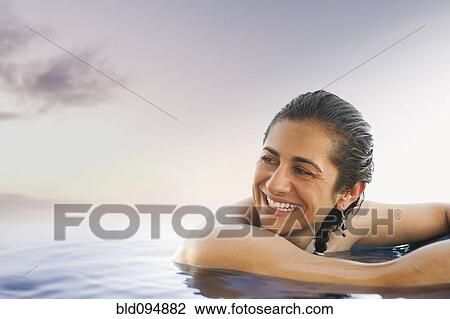 Hispanic woman enjoying swimming pool View Large Photo Image Stock Image - Hispanic woman enjoying swimming pool. Fotosearch