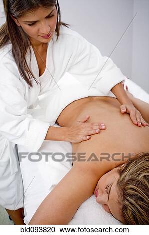 Hispanic woman having a massage View Large Photo Image Stock Image - Hispanic woman having a massage. Fotosearch