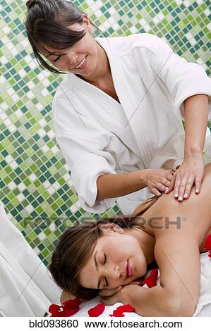 Hispanic woman having a massage View Large Photo Image Stock Image - Hispanic woman having a massage. Fotosearch