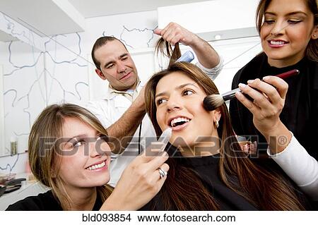 Picture - Hispanic woman having beauty treatments in salon. Fotosearch