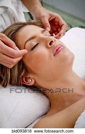 Stock Photo - Hispanic woman having facial. Fotosearch