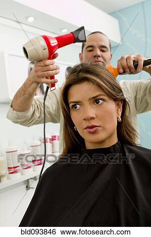Stock Photograph - Hispanic woman in beauty salon. Fotosearch