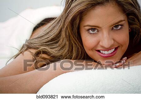 Hispanic woman laying on massage table View Large Photo Image Stock Image - Hispanic woman laying on massage table. Fotosearch